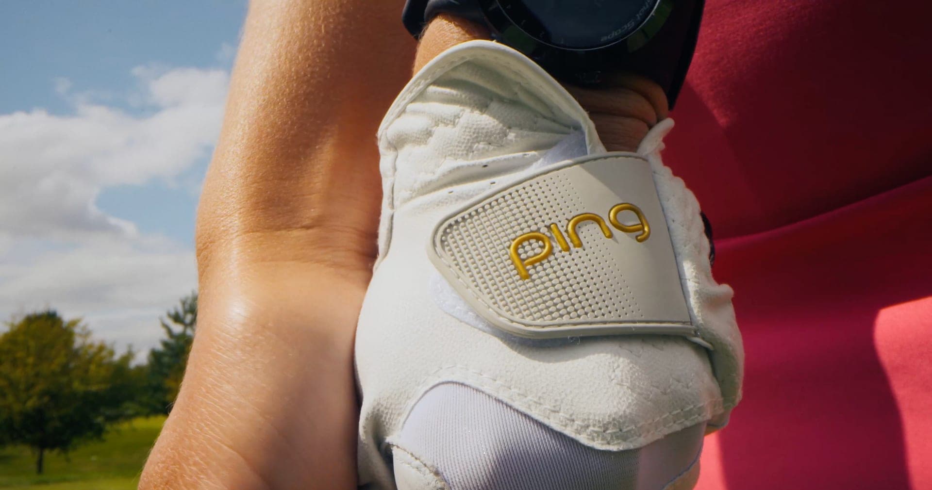Hannah Holden wearing PING apparel mid-swing
