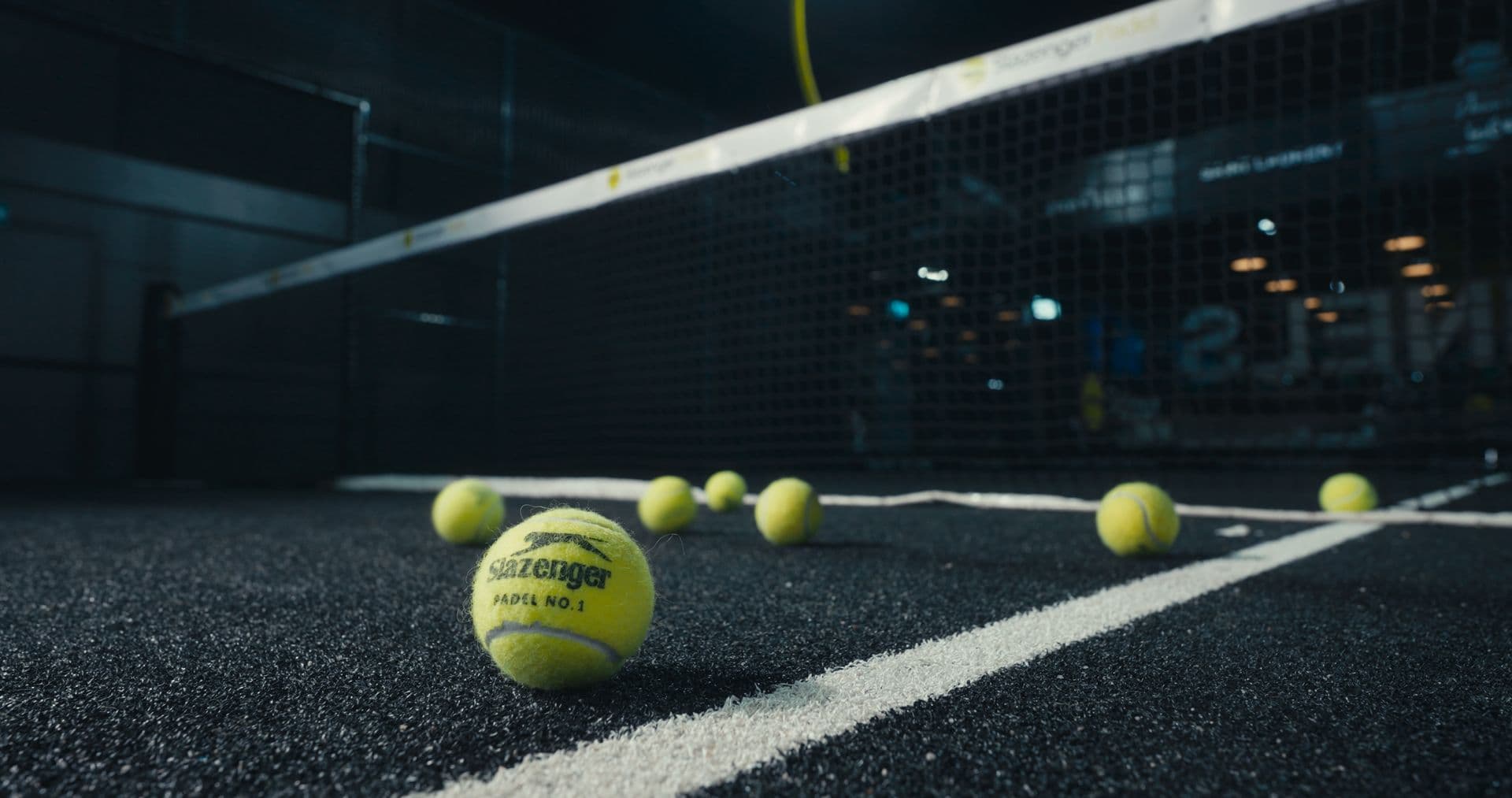 Network Padel court under floodlights